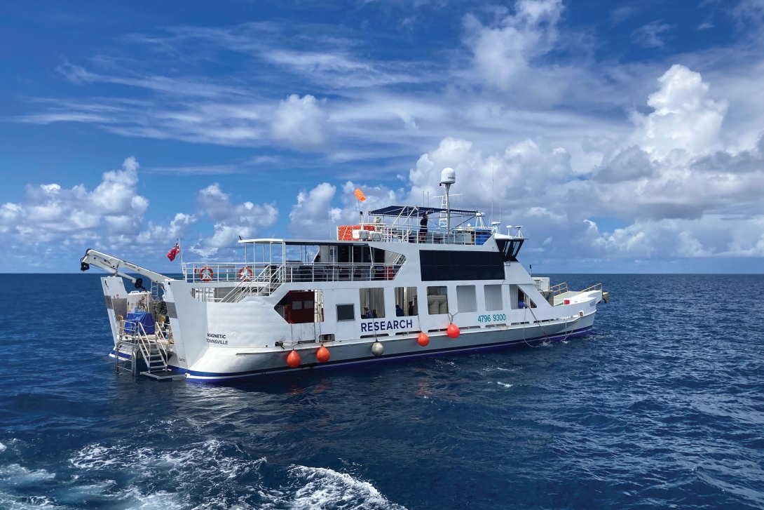 A large research vessel on the ocean. 